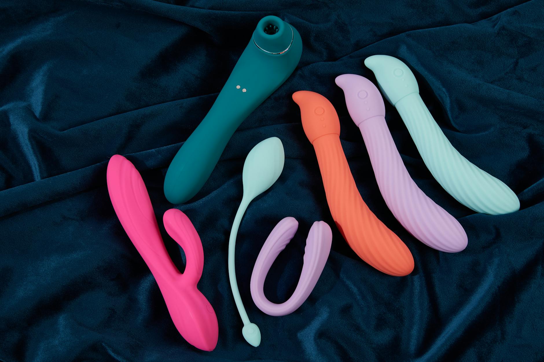 Close-up of a hand holding a vibrator, representing pleasure and intimacy while managing medication side effects